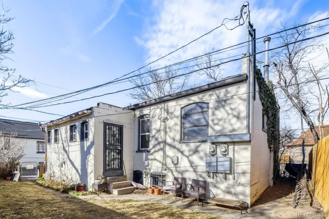 a view of a backyard with a wooden fence