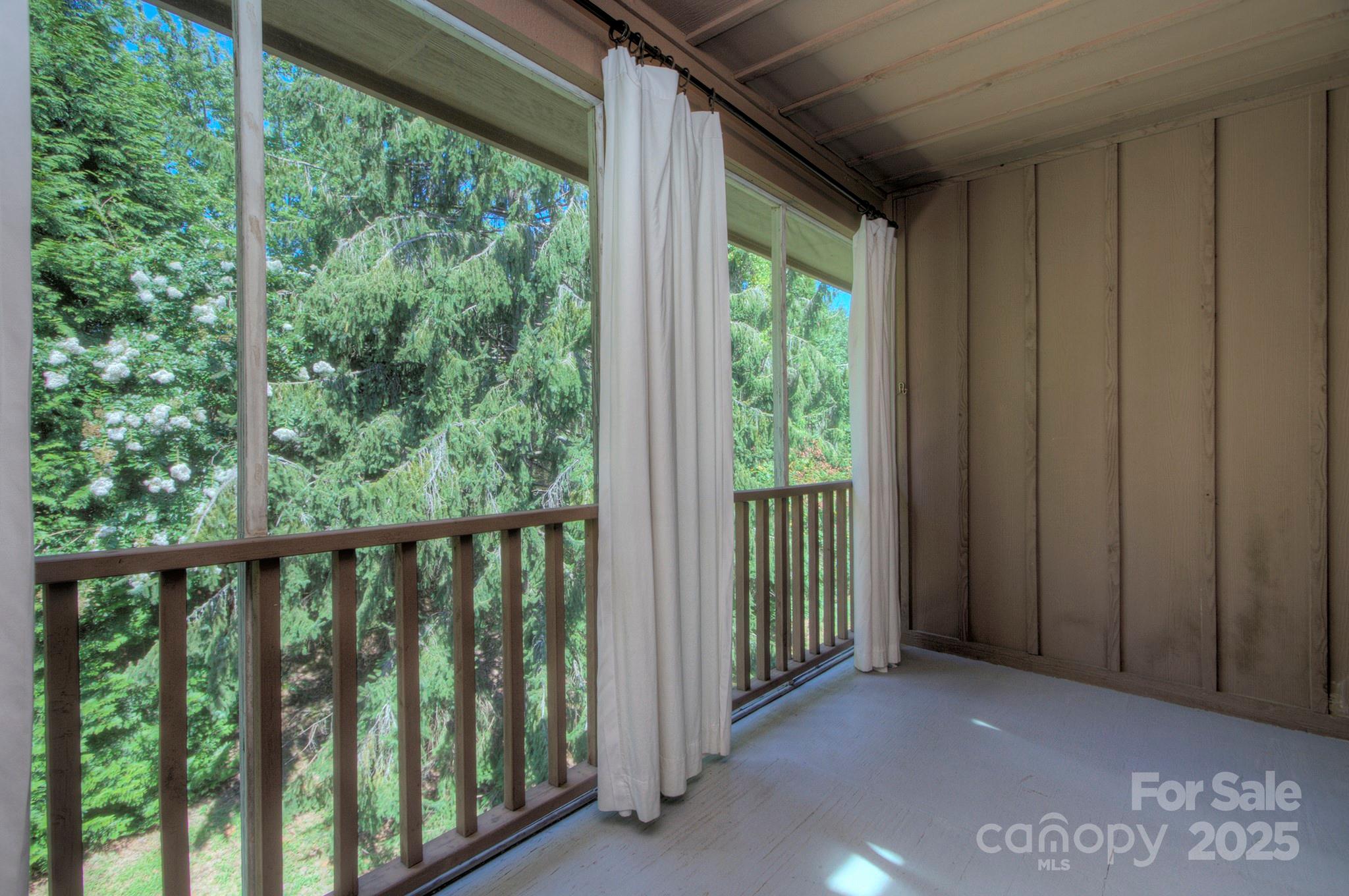 1104 Deermouse Way Hendersonville, NC 28792 - Photo 14 of 32 a view of a porch with a yard