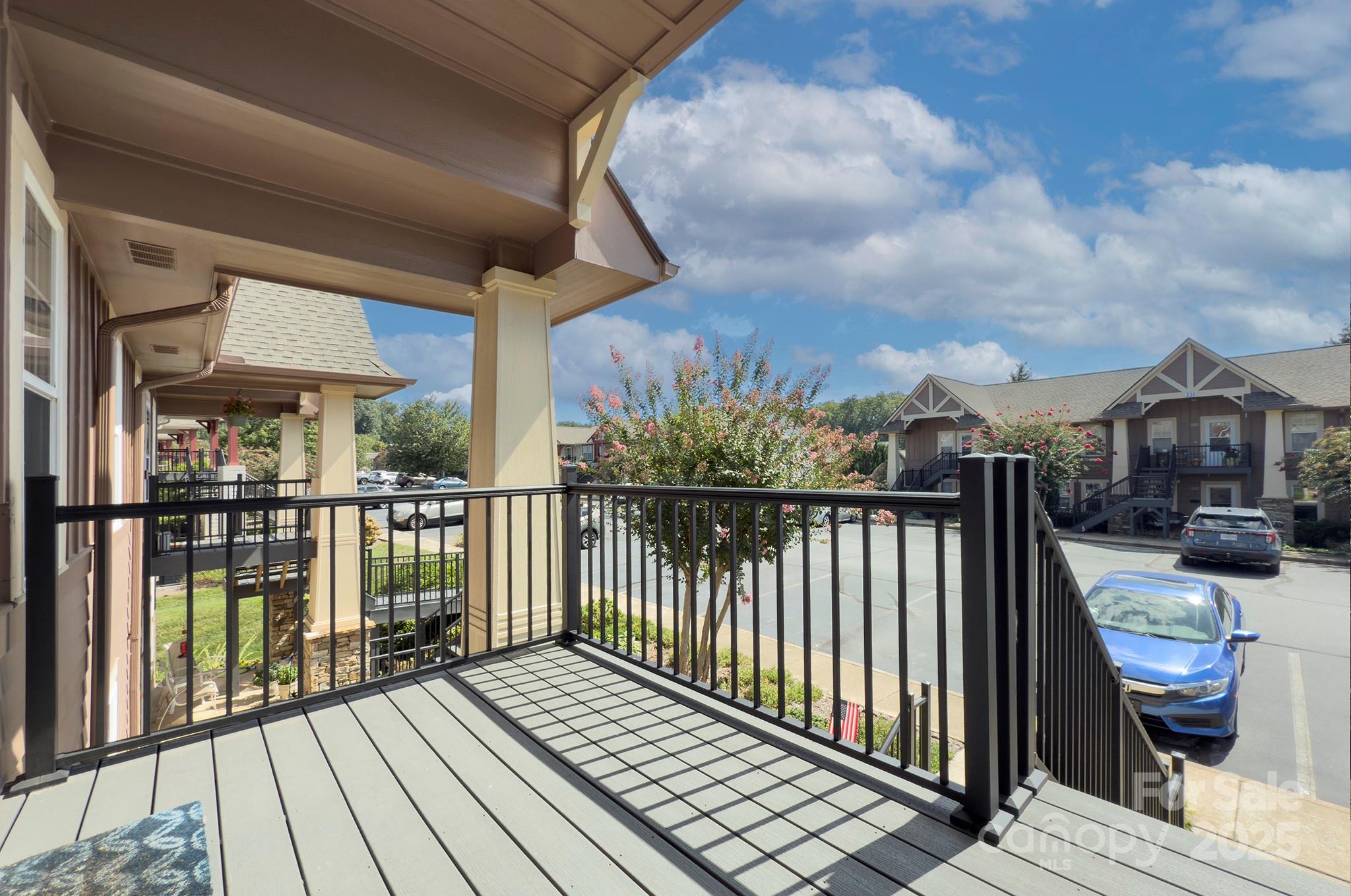 1104 Deermouse Way Hendersonville, NC 28792 - Photo 2 of 32 a view of a balcony with wooden floor