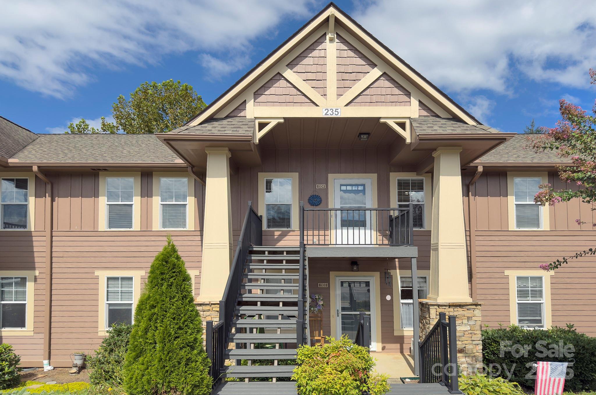 1104 Deermouse Way Hendersonville, NC 28792 - Photo 23 of 32 a front view of a house with a yard