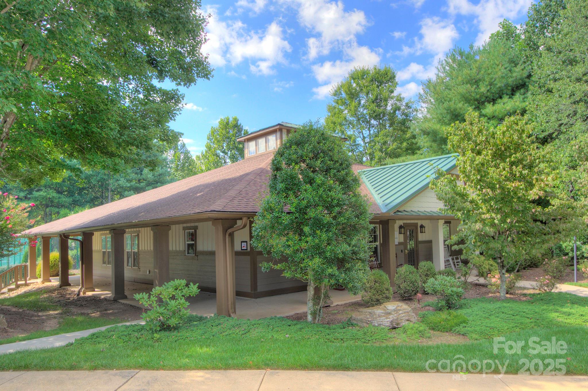 1104 Deermouse Way Hendersonville, NC 28792 - Photo 24 of 32 a view of a house with a yard and potted plants