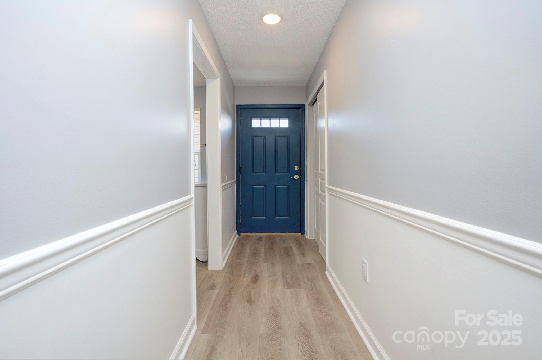 1104 Deermouse Way Hendersonville, NC 28792 - Photo 3 of 32 a view of hallway with wooden floor