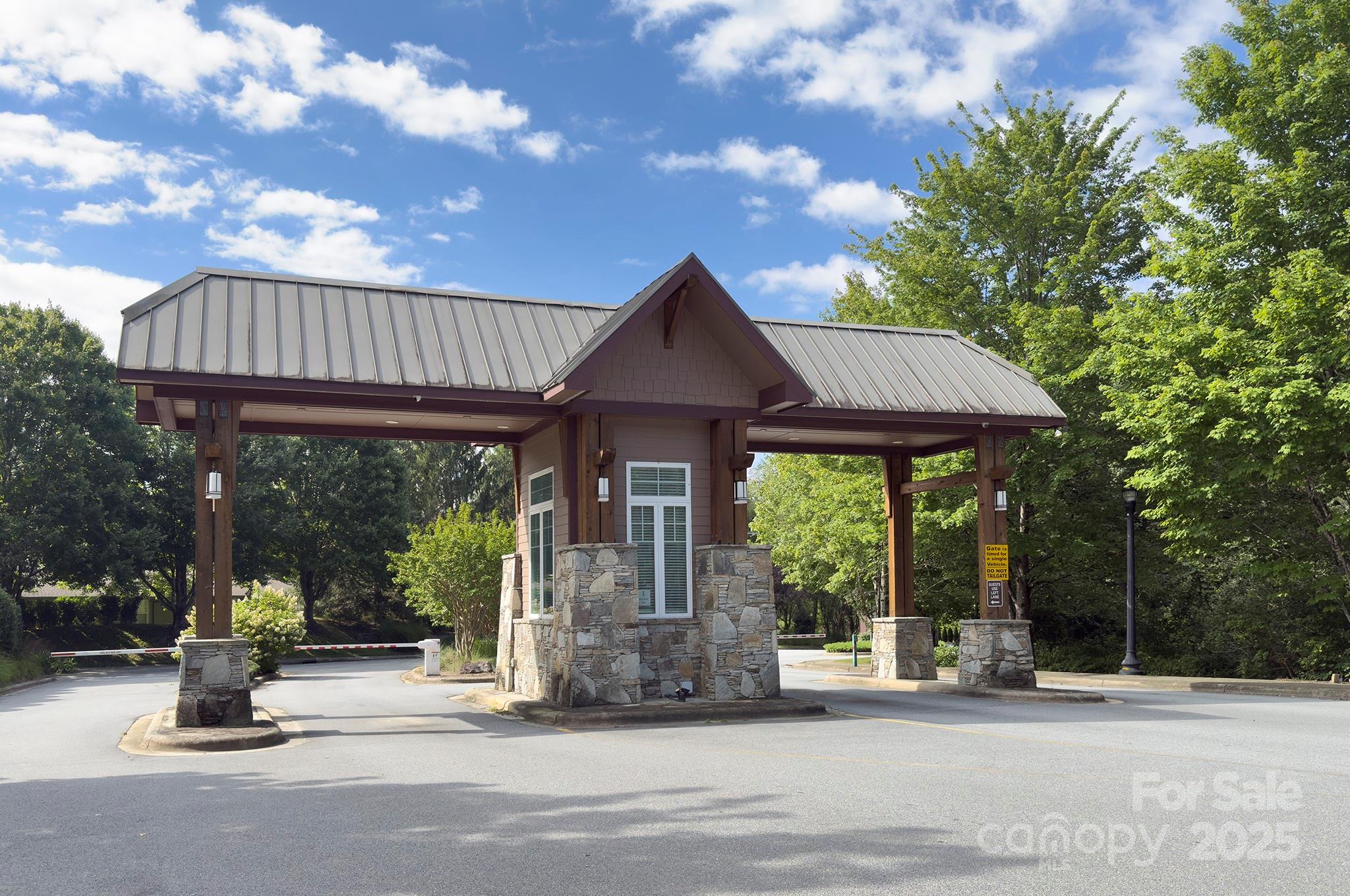 1104 Deermouse Way Hendersonville, NC 28792 - Photo 32 of 32 a view of a house with backyard porch and sitting area