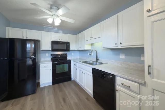 a kitchen with a refrigerator stove and microwave