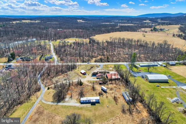 a view of swimming pool with a patio and a yard