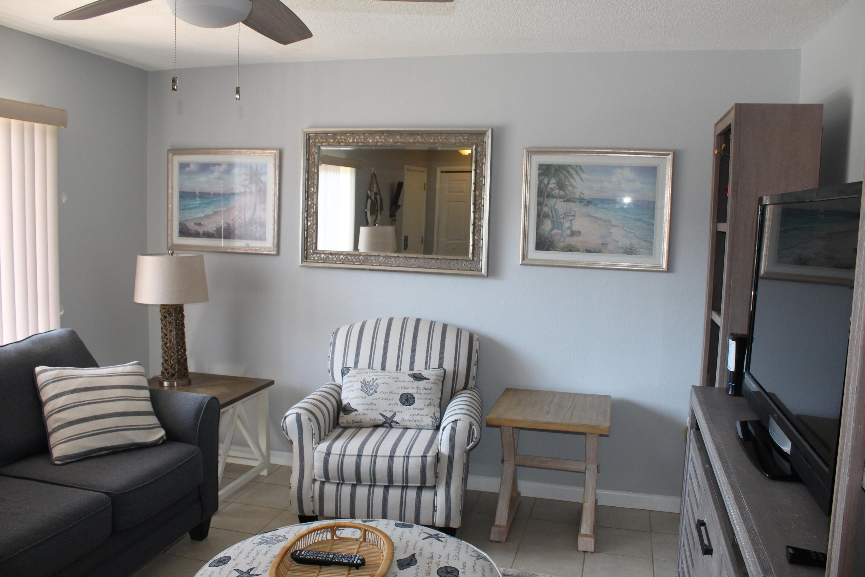 3150 North Atlantic Avenue, Unit 14880 Cocoa Beach, FL 32931 - Photo 5 of 13 a bedroom with furniture and a window