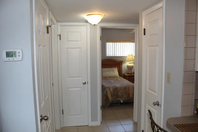 a living room with a bed furniture and a window
