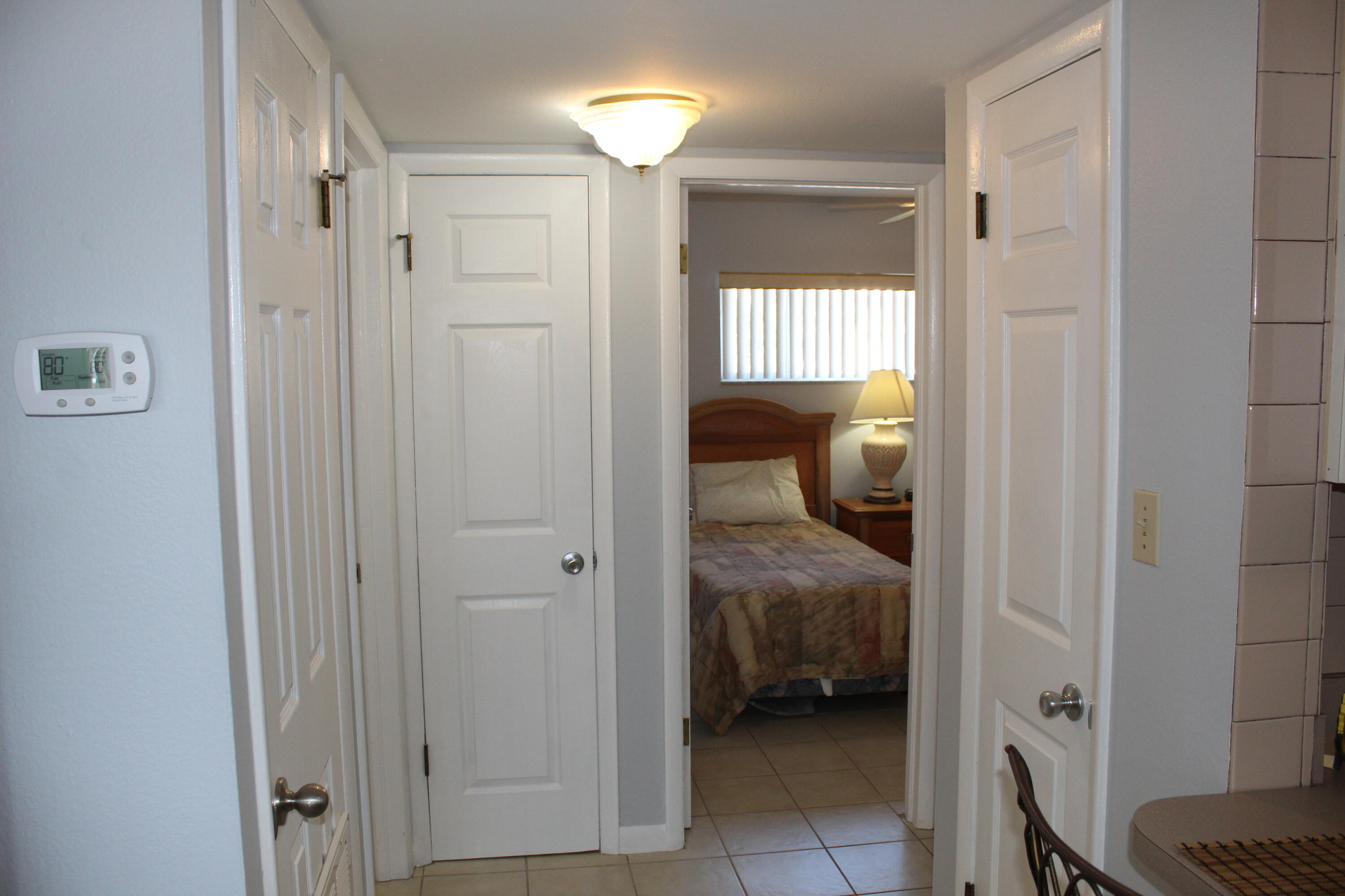 3150 North Atlantic Avenue, Unit 14880 Cocoa Beach, FL 32931 - Photo 7 of 13 a en suite bathroom with a sink and a shower