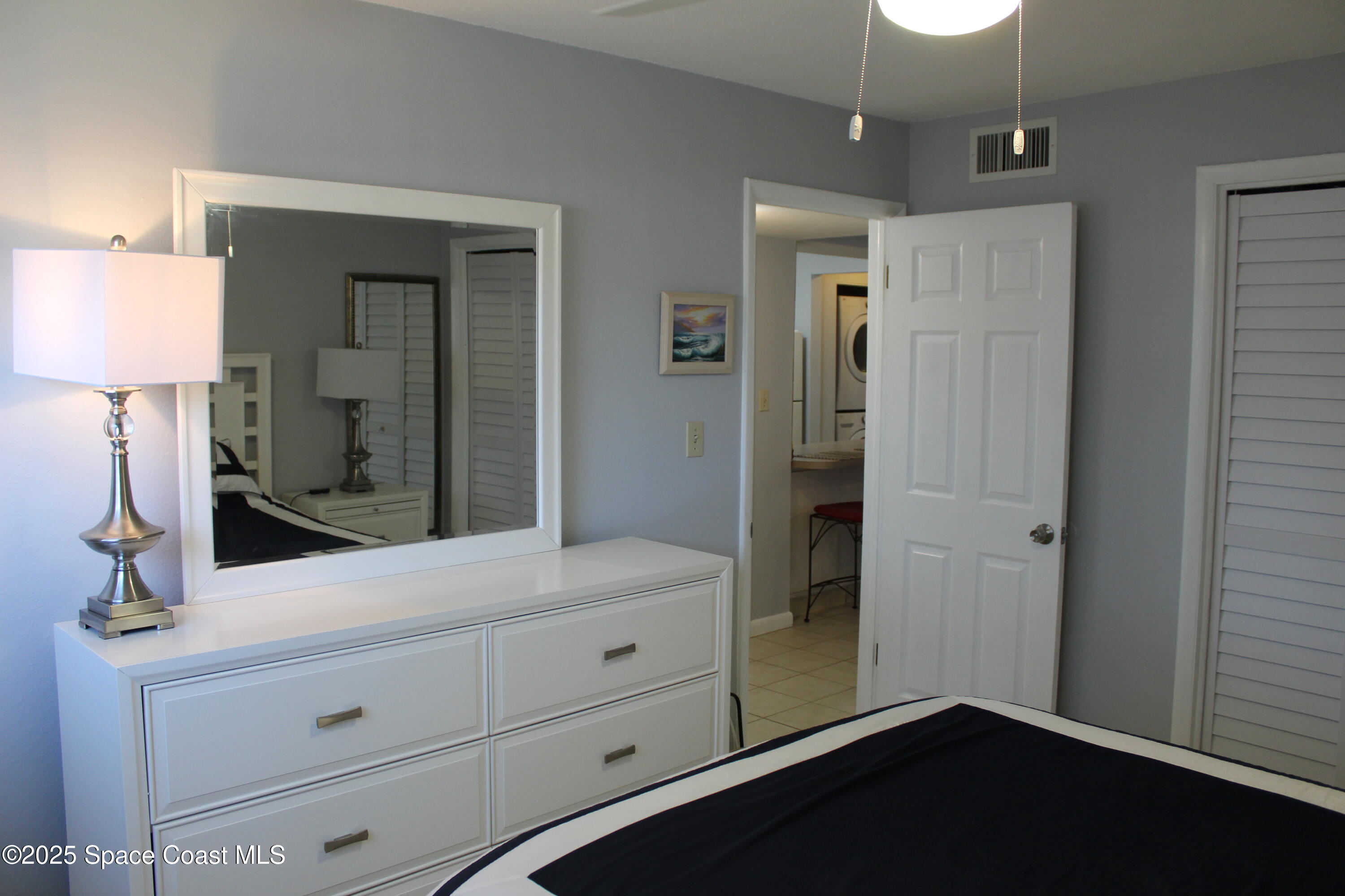 3150 North Atlantic Avenue, Unit 14880 Cocoa Beach, FL 32931 - Photo 9 of 13 a bathroom with a sink and a mirror