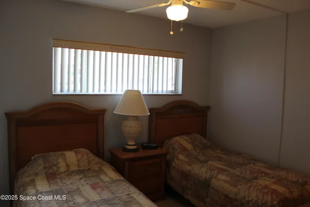 a bedroom with a bed and a mirror