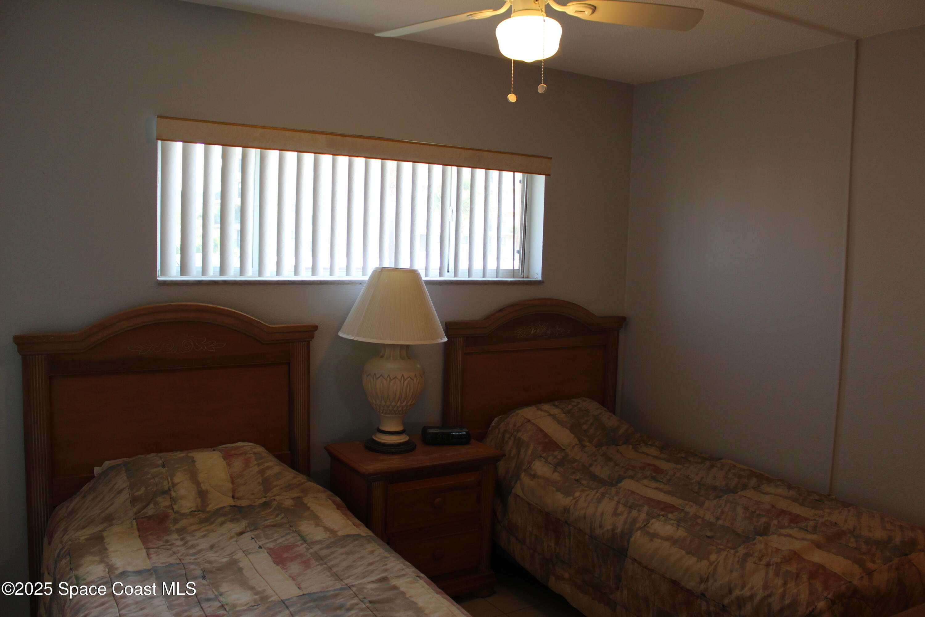 3150 North Atlantic Avenue, Unit 14880 Cocoa Beach, FL 32931 - Photo 10 of 13 a workspace with furniture and a window