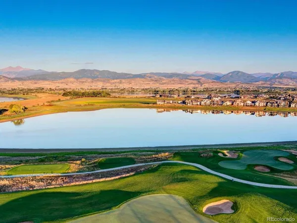 a view of a swimming pool with a table and chairs