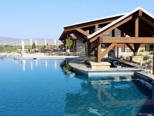 a view of a lake with houses in the back