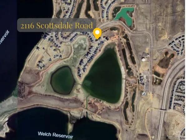 a view of green field with an ocean