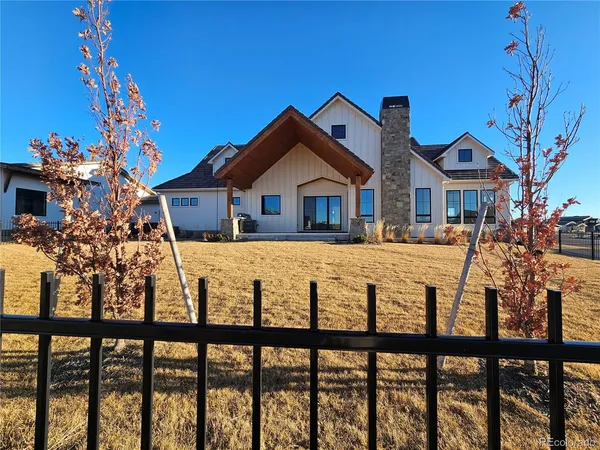 a view of a dining room with furniture wooden floor and chandelier