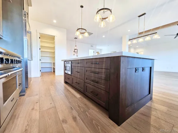 a bathroom with a glass shower door and a sink