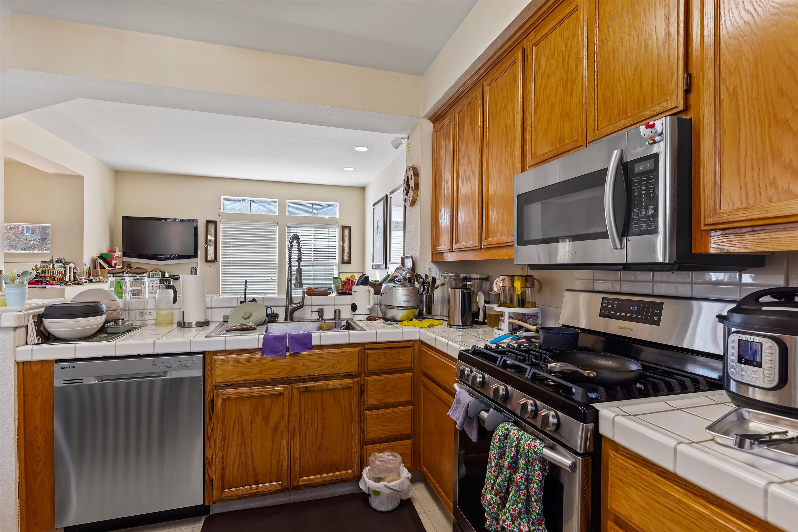 3567 Dayton Common Fremont, CA 94538 - Photo 13 of 29 a kitchen with a sink stove top oven and microwave