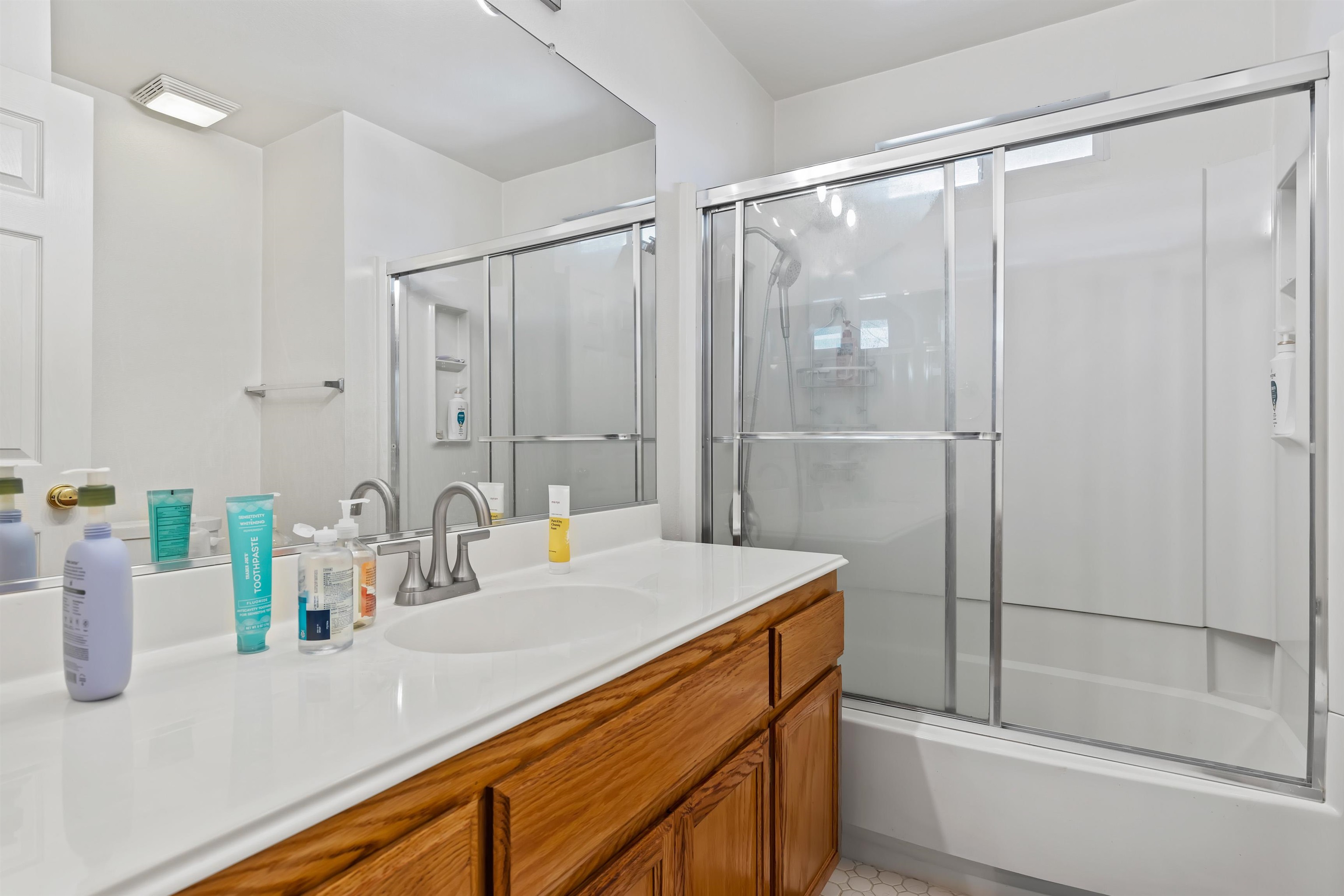 3567 Dayton Common Fremont, CA 94538 - Photo 22 of 29 a bathroom with a shower sink and mirror