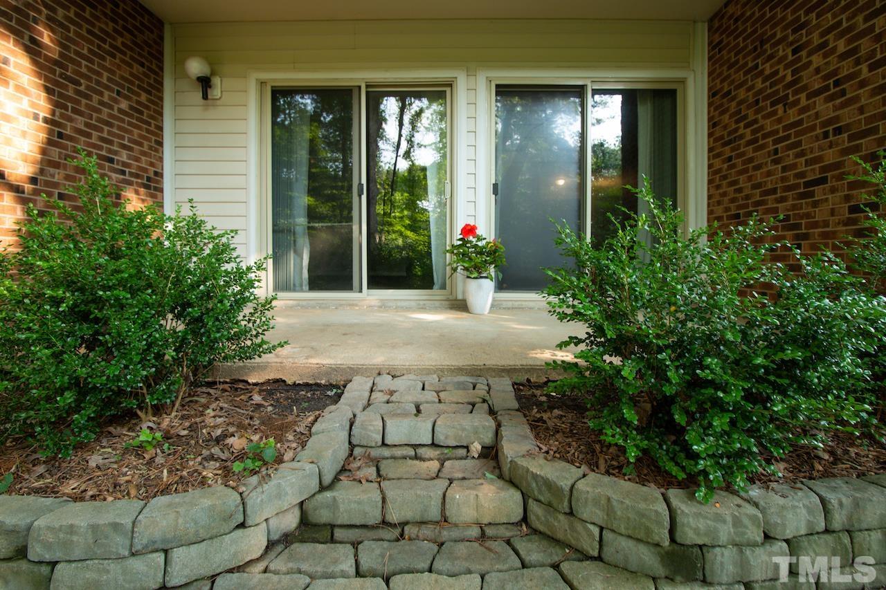 4711 Edwards Mill Road, Unit C Raleigh, NC 27612 - Photo 12 of 13 a front view of a house with a porch