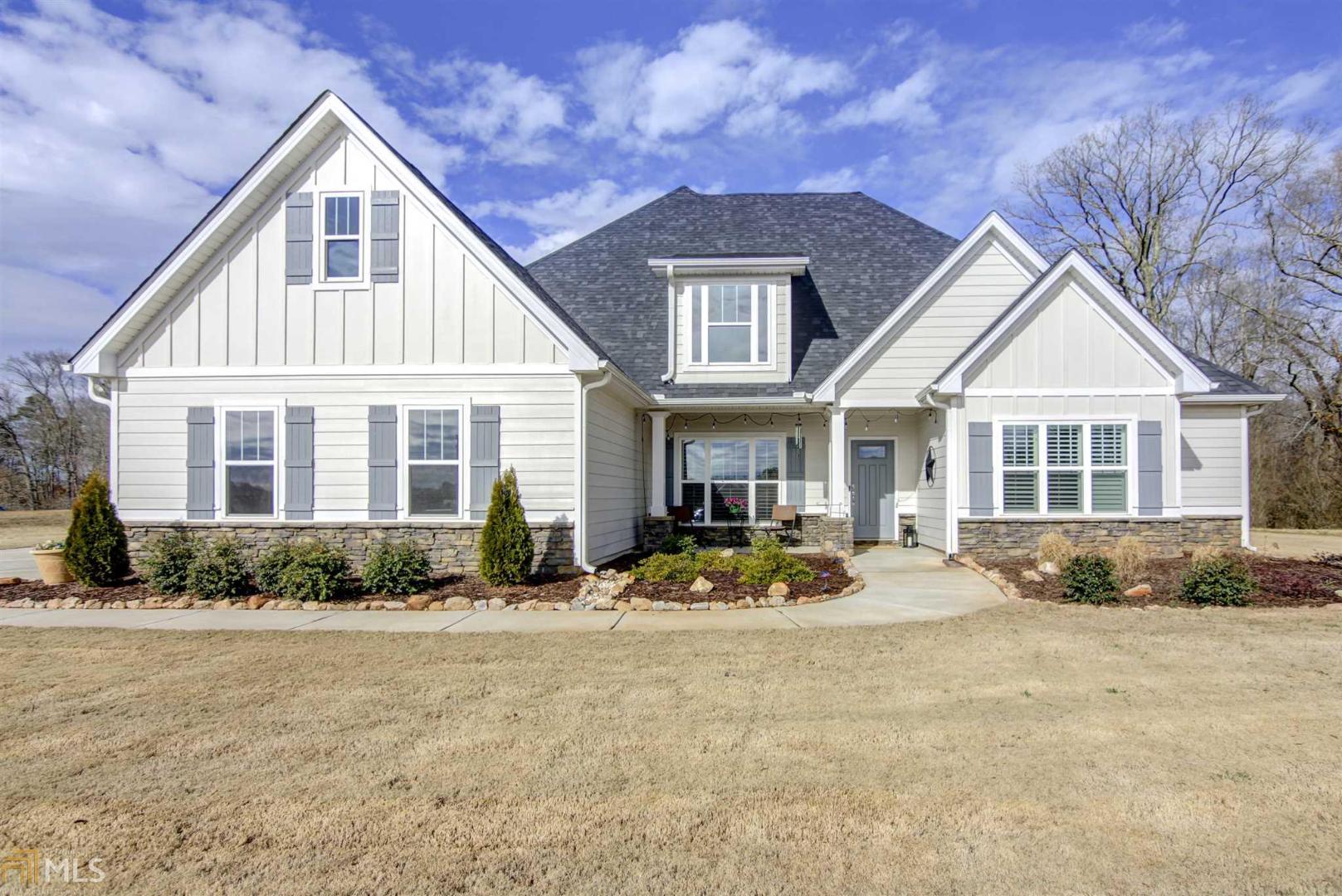 593 Mask Road Brooks, GA 30205 - Photo 1 of 1 a front view of a house with a yard
