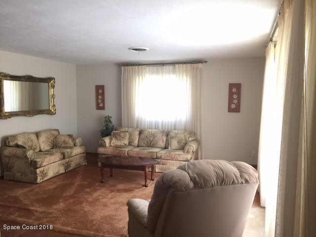 7414 Rodes Place Melbourne, FL 32904 - Photo 3 of 21 Living room