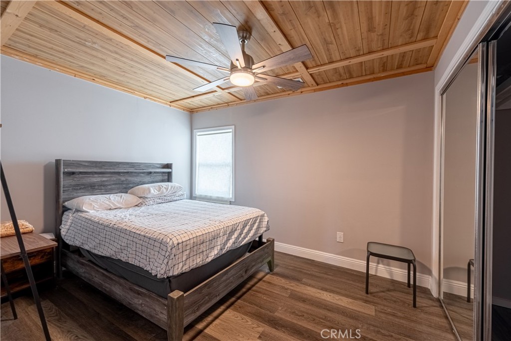 4759 Cochran Street Simi Valley, CA 93063 - Photo 16 of 71 a bedroom with a bed and a chair