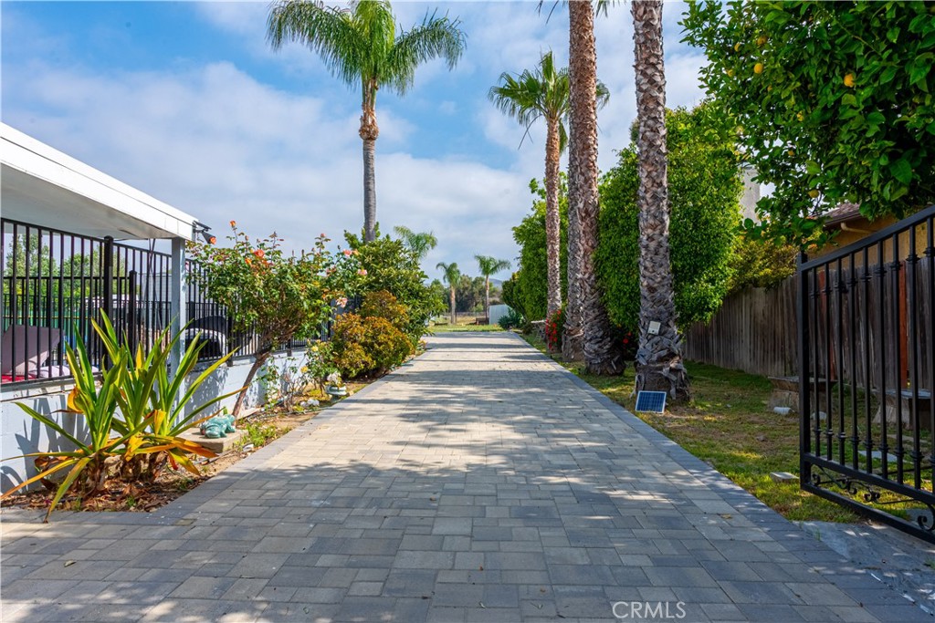 4759 Cochran Street Simi Valley, CA 93063 - Photo 2 of 71 a view of a backyard with potted plants and large trees