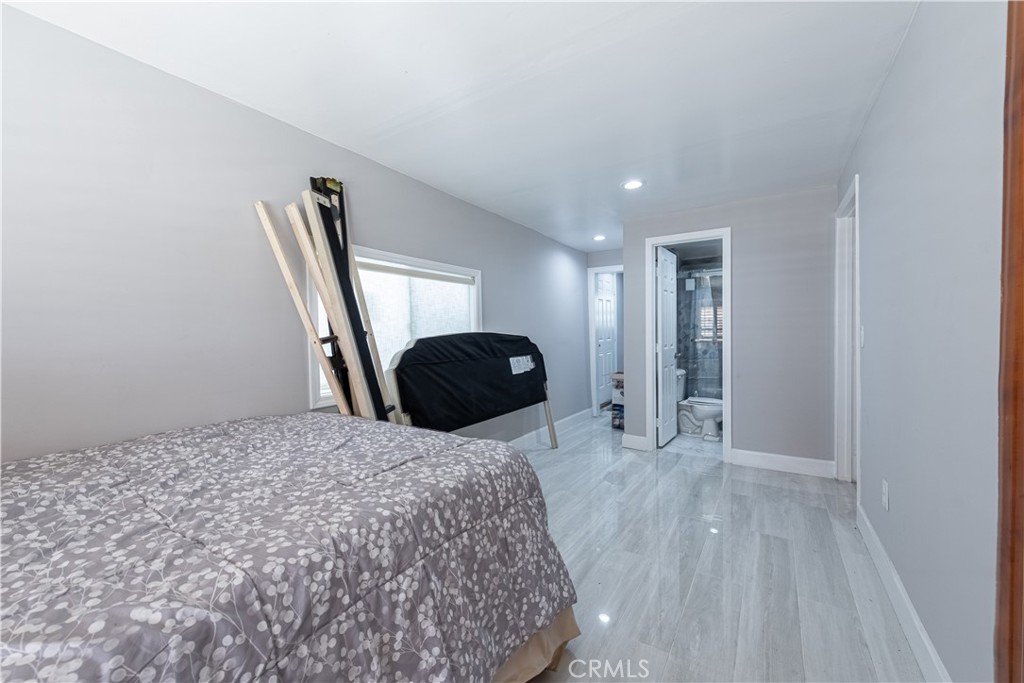 4759 Cochran Street Simi Valley, CA 93063 - Photo 23 of 71 a bedroom with a bed and a dresser