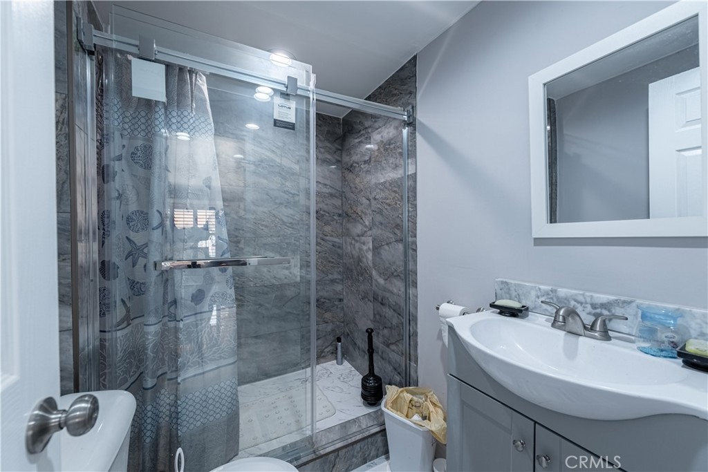 4759 Cochran Street Simi Valley, CA 93063 - Photo 26 of 71 a bathroom with a sink toilet and shower