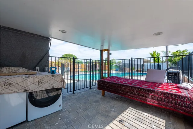 an aerial view of a house with swimming pool garden and patio