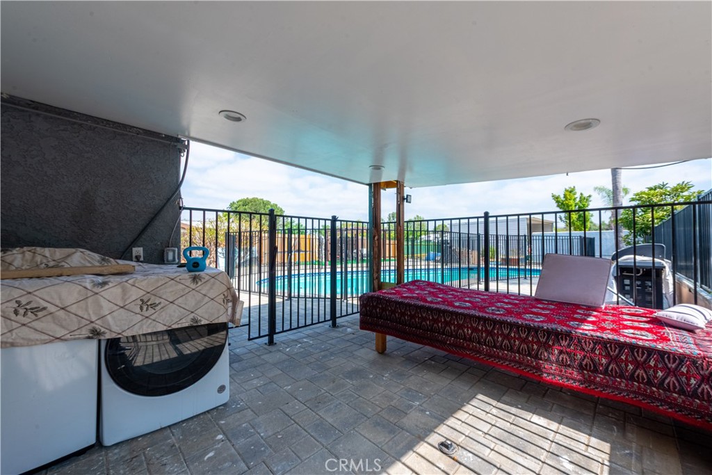 4759 Cochran Street Simi Valley, CA 93063 - Photo 27 of 71 a bed room with a bed and a wooden floor
