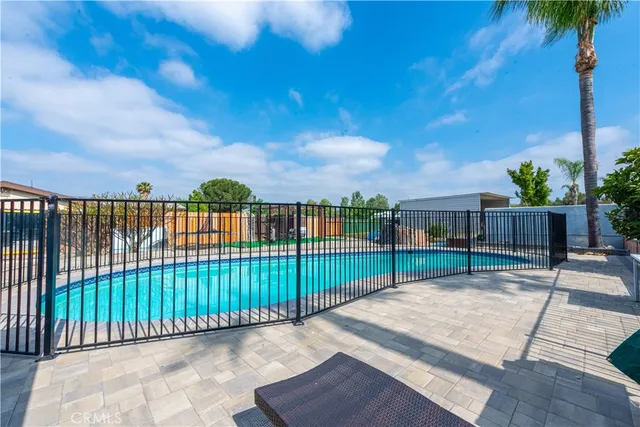 an outdoor space with seating area and garden