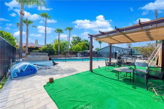a view of a swimming pool with a patio