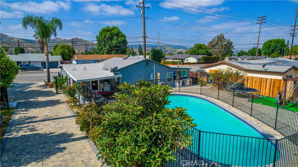 4759 Cochran Street Simi Valley, CA 93063 - Photo 33 of 71 an aerial view of a house with swimming pool garden and patio