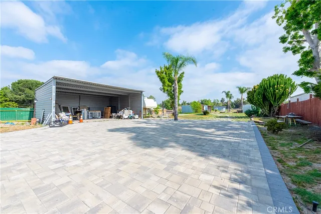 a pathway of a house with a yard