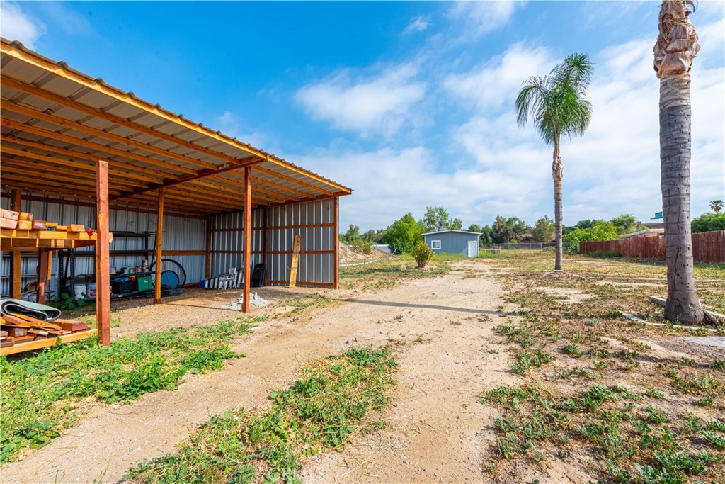 4759 Cochran Street Simi Valley, CA 93063 - Photo 49 of 71 a view of a house with a yard and potted plants