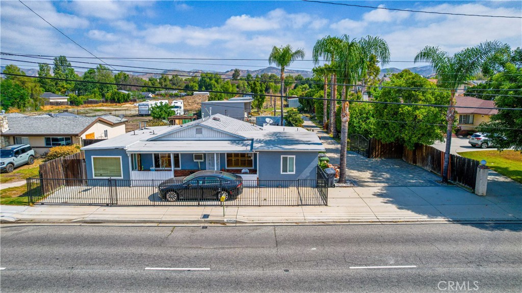 4759 Cochran Street Simi Valley, CA 93063 - Photo 6 of 71 a view of a patio with table and chairs potted plants and palm trees
