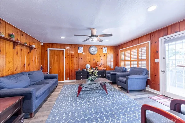 a bedroom with a bed a window and dresser
