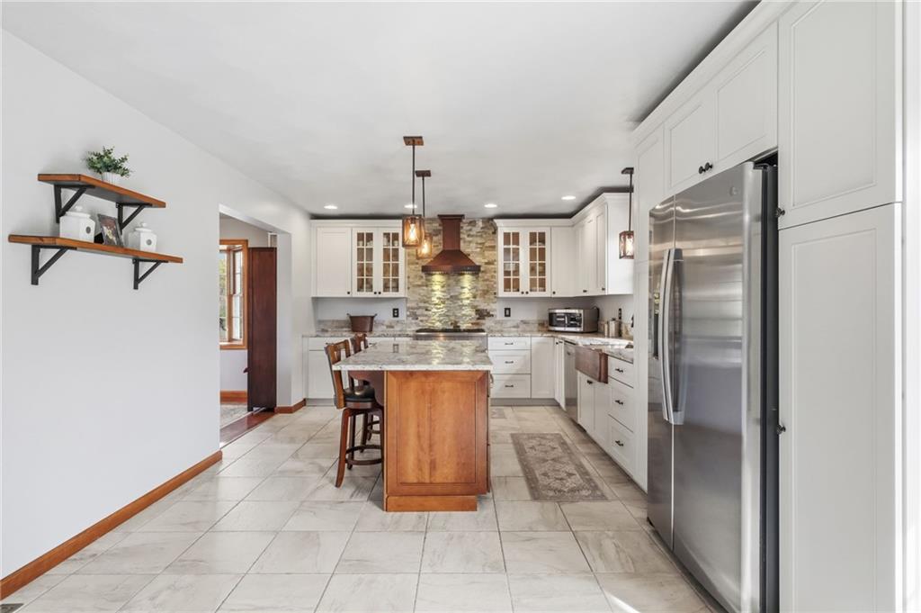 1146 Sarver Road Sarver, PA 16055 - Photo 12 of 50 a kitchen with stainless steel appliances granite countertop a refrigerator and a sink