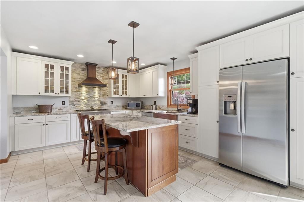 1146 Sarver Road Sarver, PA 16055 - Photo 13 of 50 a kitchen with kitchen island white cabinets and refrigerator