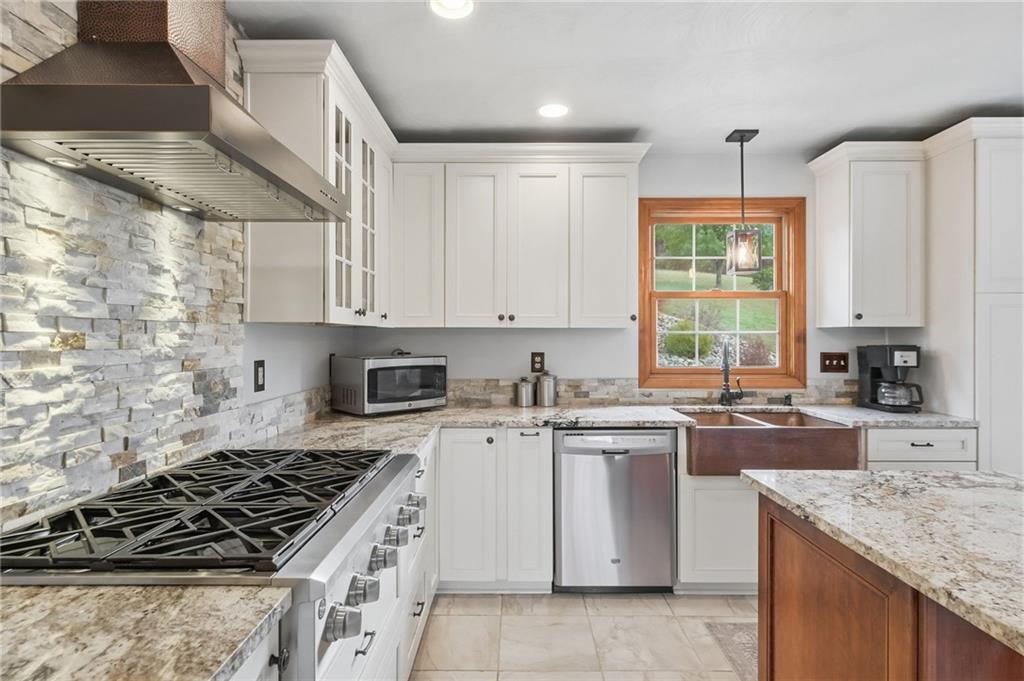 1146 Sarver Road Sarver, PA 16055 - Photo 15 of 50 a kitchen with a stove sink and cabinets