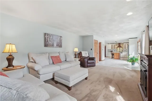 a living room with furniture and a lamp