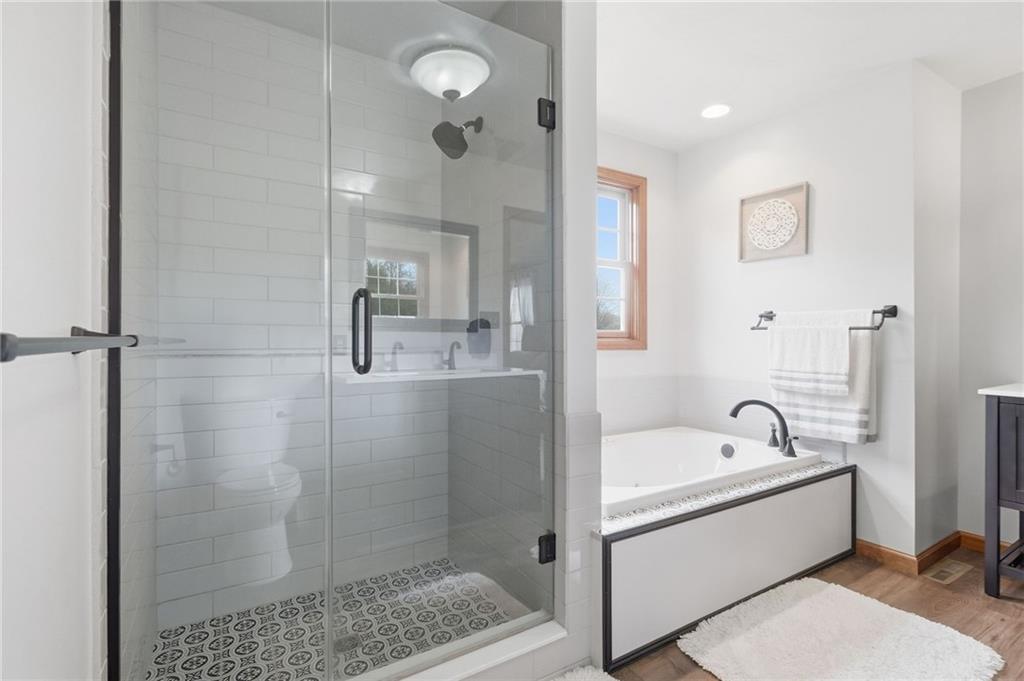 1146 Sarver Road Sarver, PA 16055 - Photo 30 of 50 a bathroom with a bathtub a shower a sink and mirror