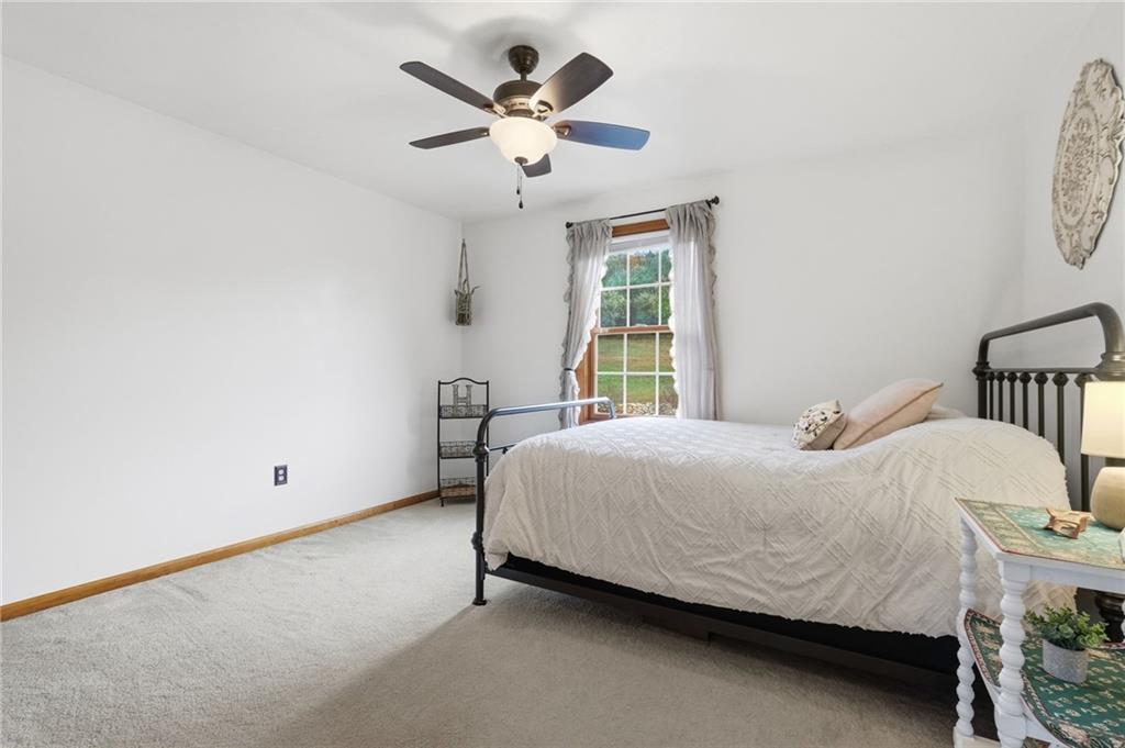 1146 Sarver Road Sarver, PA 16055 - Photo 33 of 50 a bedroom with a bed and a chandelier