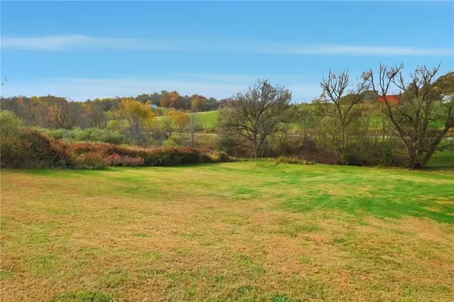 a view of a yard with an ocean
