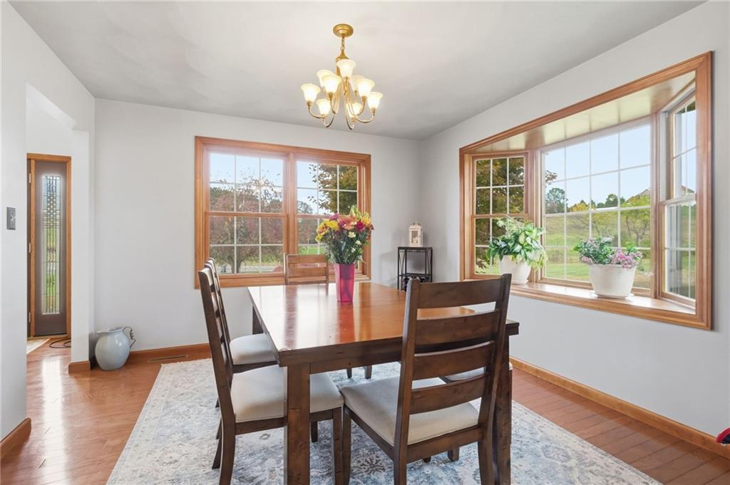 1146 Sarver Road Sarver, PA 16055 - Photo 10 of 50 a view of a dining room with furniture wooden floor and a chandelier