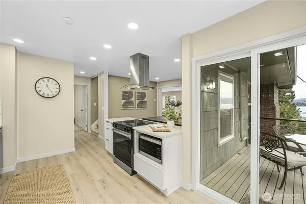 a kitchen with stainless steel appliances granite countertop a stove and a refrigerator