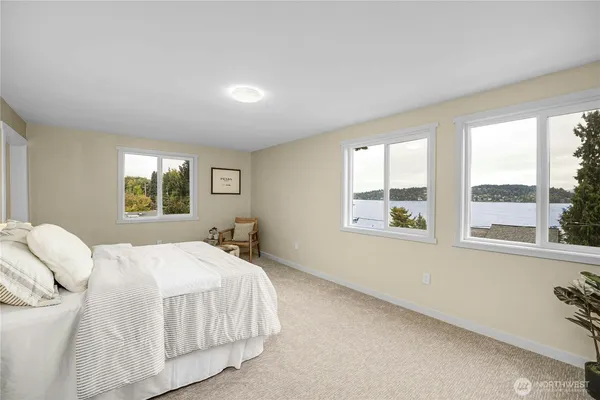 a bedroom with a large bed and a window
