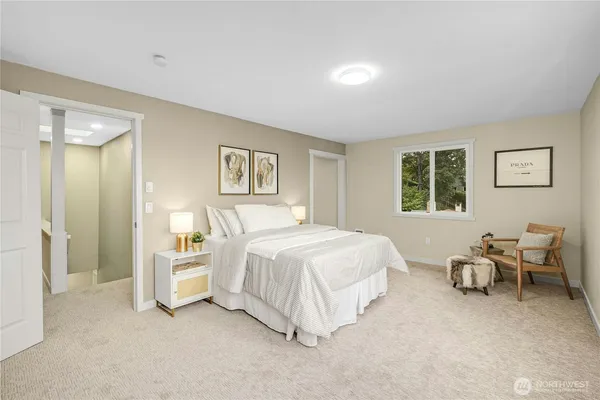 a bedroom with a bed and a couch