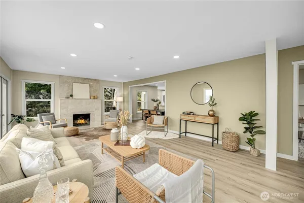 a living room with furniture couches and a fireplace